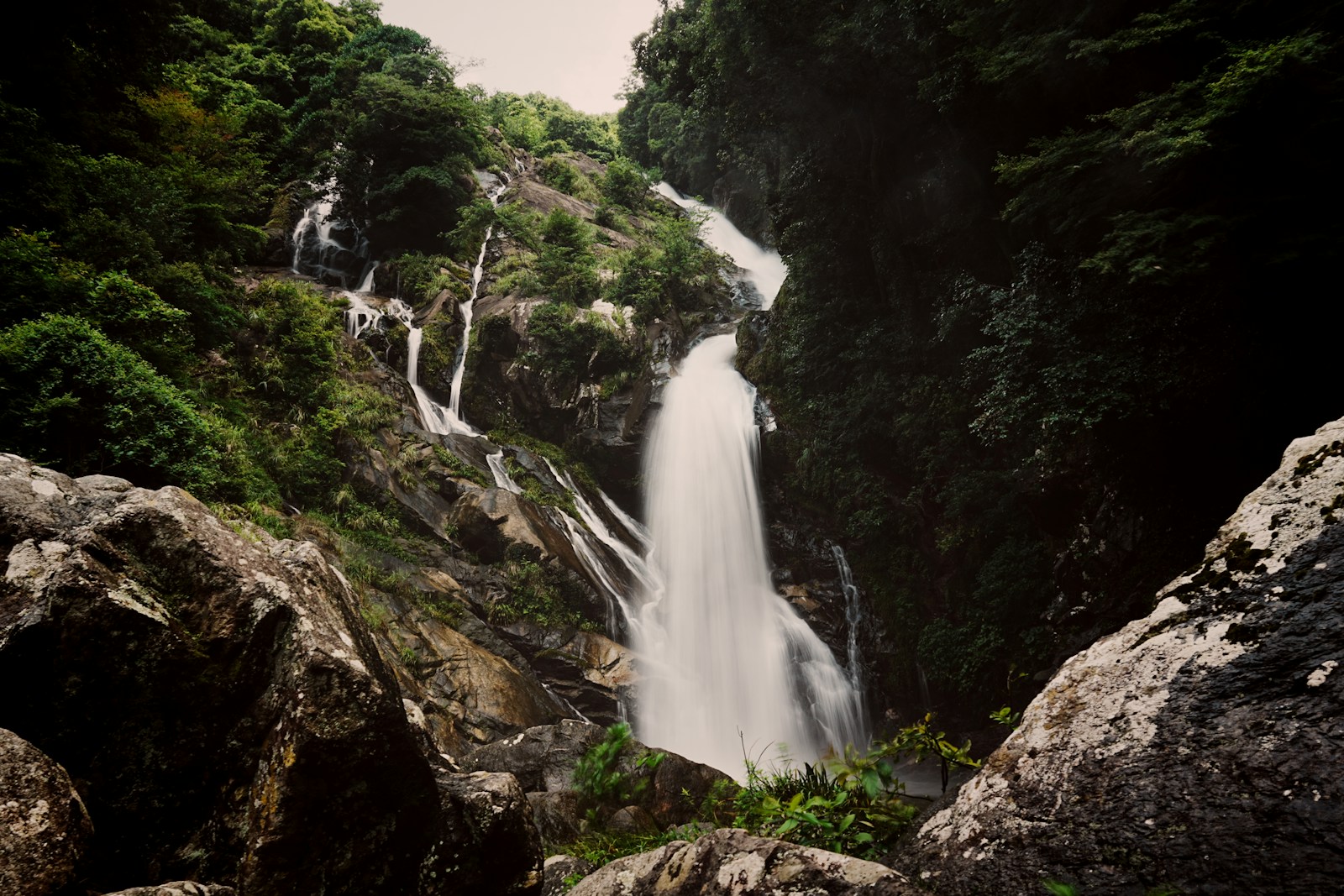 A powerful waterfall down a rocky mountainside