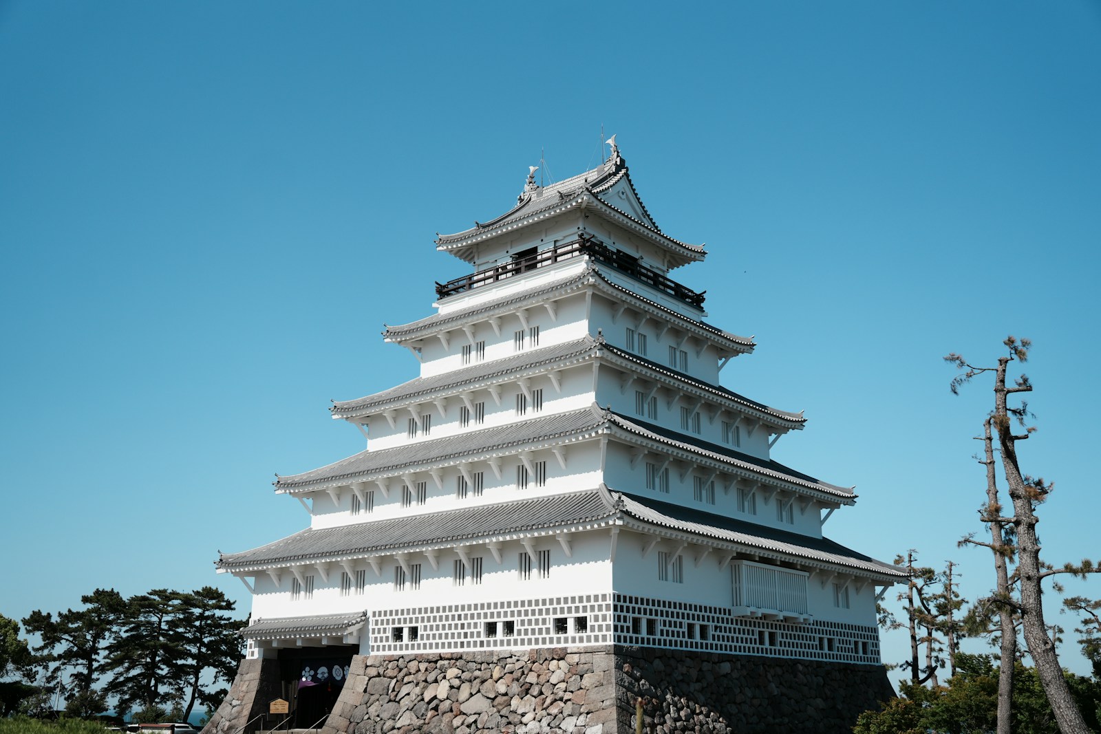 A Japanese castle against a blue sky